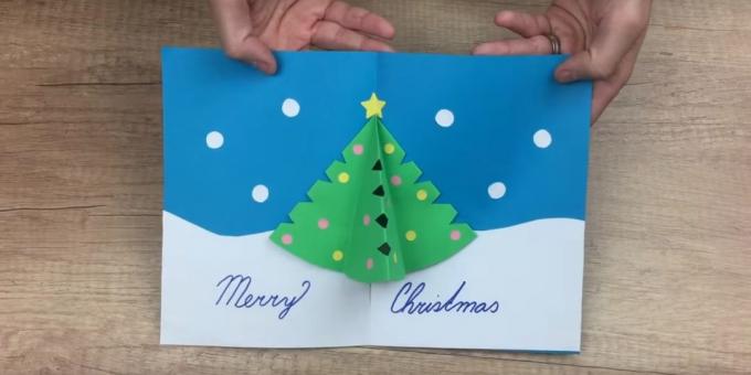 Vianočné karta s vlastnými rukami s vianočný stromček vnútri objemového